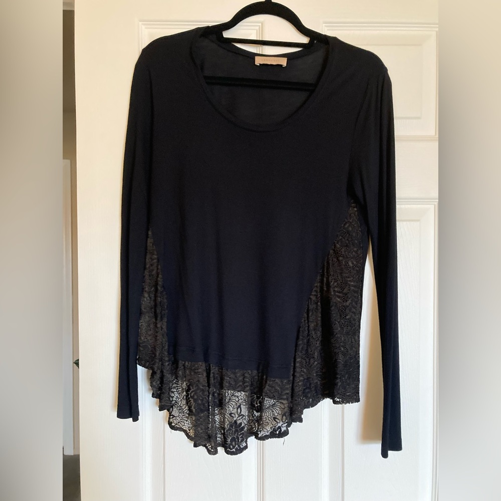 Language Black shirt with lace sides.